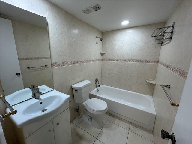 510 Cranes Way Unit 302, Altamonte Springs, FL 32701 - full bathroom featuring tile walls,  shower combination, vanity, toilet, and tile patterned floors