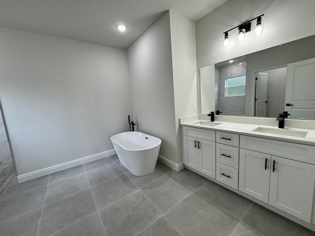 16463 SW 55th Court Rd, Ocala, FL 34473 - full bathroom with double vanity, a soaking tub, baseboards, a textured ceiling, and recessed lighting
