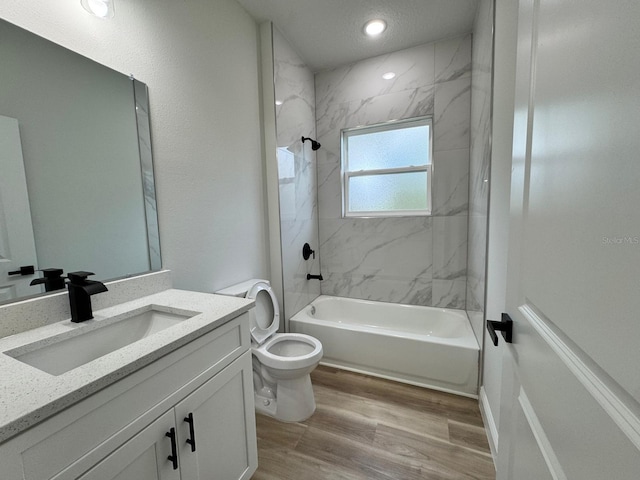 16463 SW 55th Court Rd, Ocala, FL 34473 - full bathroom with vanity, toilet, tub / shower combination, wood finished floors, and recessed lighting