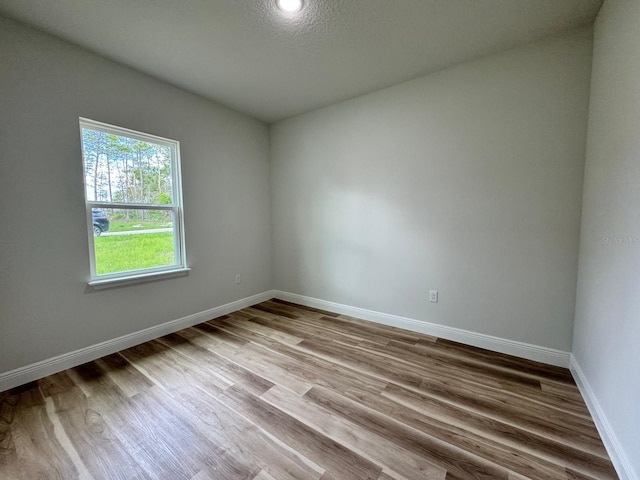16463 SW 55th Court Rd, Ocala, FL 34473 - empty room featuring wood finished floors and baseboards