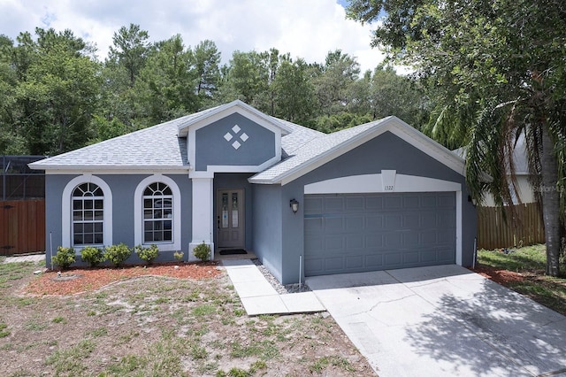 1322 Reagans Reserve Blvd, Apopka, FL 32712 - ranch-style home featuring a shingled roof, stucco siding, a garage, and driveway