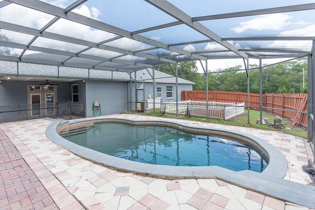 1322 Reagans Reserve Blvd, Apopka, FL 32712 - view of swimming pool featuring a fenced backyard, glass enclosure, a patio, and a ceiling fan