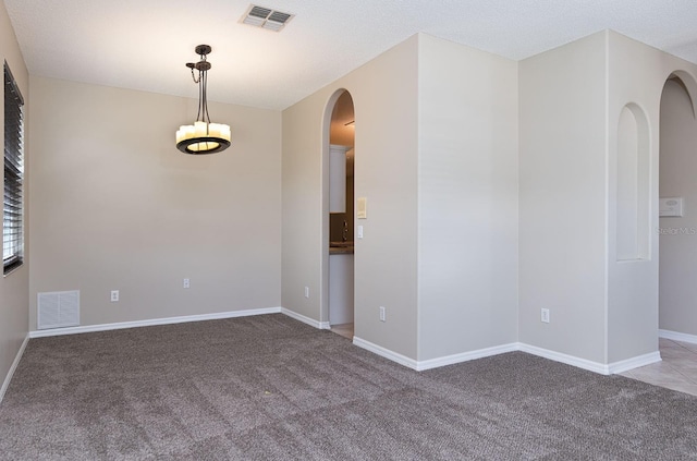 1322 Reagans Reserve Blvd, Apopka, FL 32712 - empty room featuring light colored carpet and arched walkways