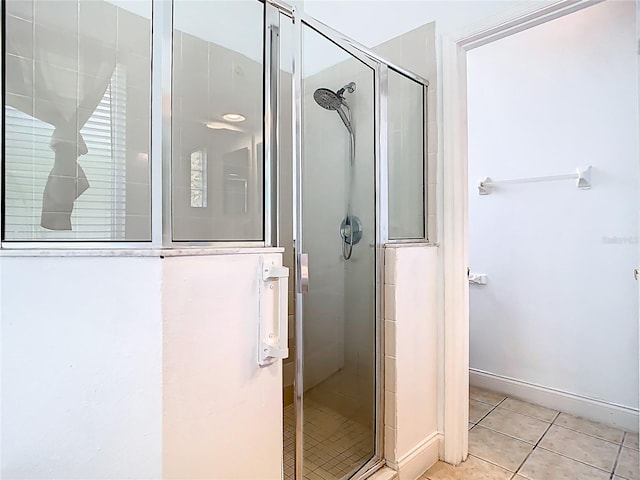 6843 Cherry Grove Cir, Orlando, FL 32809 - full bath featuring tile patterned flooring, a stall shower, and baseboards