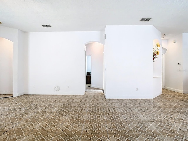 6843 Cherry Grove Cir, Orlando, FL 32809 - empty room featuring arched walkways