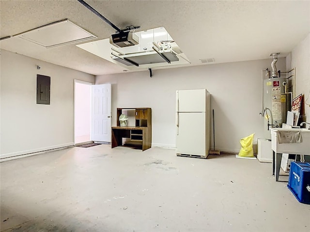 6843 Cherry Grove Cir, Orlando, FL 32809 - garage featuring freestanding refrigerator, electric panel, a garage door opener, and water heater
