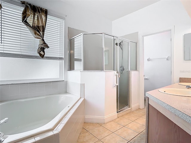 6843 Cherry Grove Cir, Orlando, FL 32809 - full bathroom featuring a shower stall, a bath, tile patterned flooring, vanity, and baseboards