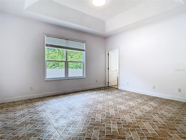 6843 Cherry Grove Cir, Orlando, FL 32809 - unfurnished room with baseboards and a raised ceiling