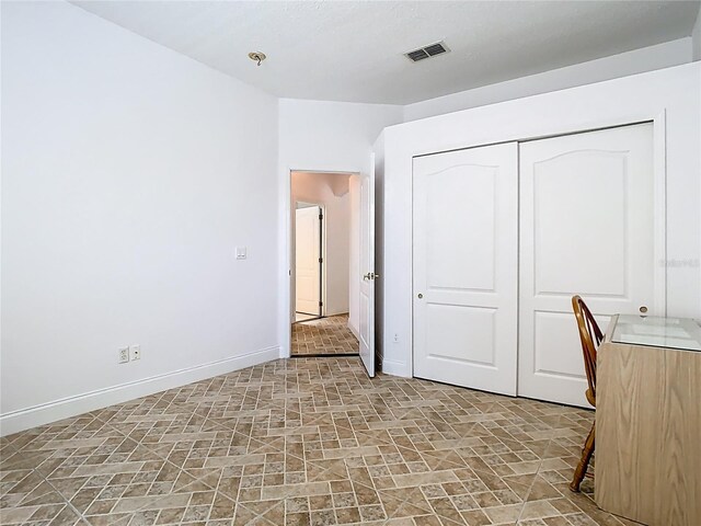 6843 Cherry Grove Cir, Orlando, FL 32809 - unfurnished office featuring stone finish flooring and baseboards