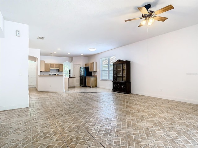 6843 Cherry Grove Cir, Orlando, FL 32809 - unfurnished living room featuring baseboards, a ceiling fan, recessed lighting, and a sink