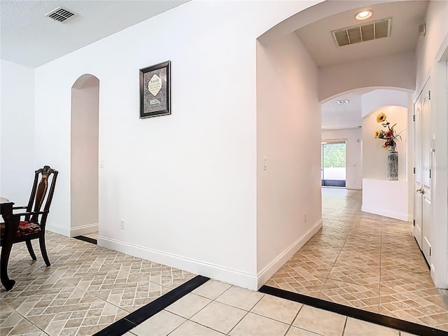6843 Cherry Grove Cir, Orlando, FL 32809 - corridor with baseboards, light tile patterned floors, recessed lighting, and inlaid floor details