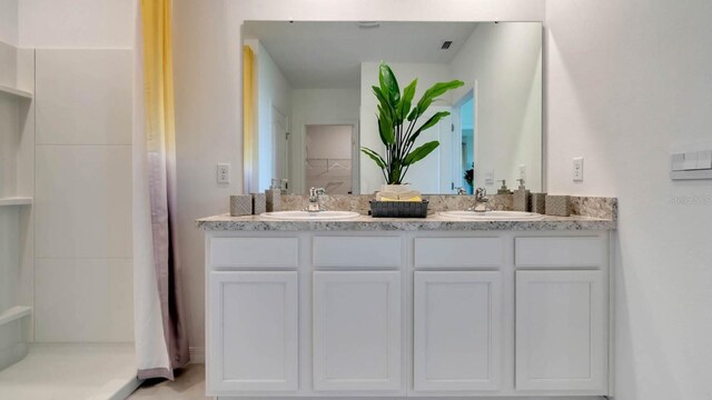 946 Princess Sabal Pt, Haines City, FL 33844 - full bath with double vanity and a shower with shower curtain