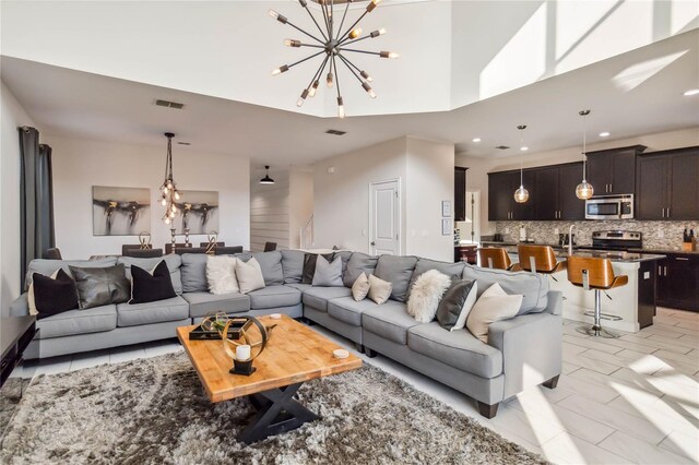 4740 Sleepy Hollow Dr, Kissimmee, FL 34746 - living room featuring a chandelier and recessed lighting
