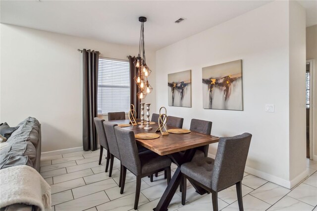4740 Sleepy Hollow Dr, Kissimmee, FL 34746 - dining space with baseboards