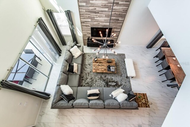 4740 Sleepy Hollow Dr, Kissimmee, FL 34746 - living area featuring marble finish flooring and a towering ceiling