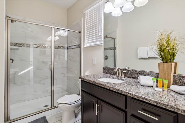 4740 Sleepy Hollow Dr, Kissimmee, FL 34746 - full bathroom featuring a chandelier, vanity, toilet, and a shower stall