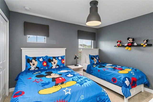 4740 Sleepy Hollow Dr, Kissimmee, FL 34746 - bedroom featuring carpet floors, baseboards, and a closet