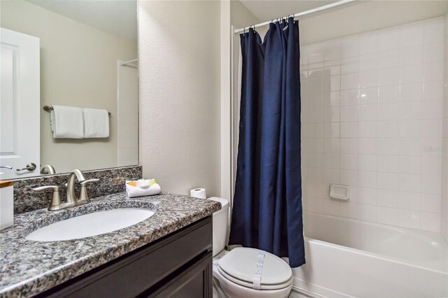 4740 Sleepy Hollow Dr, Kissimmee, FL 34746 - full bathroom featuring vanity, toilet, and shower / bath combination with curtain