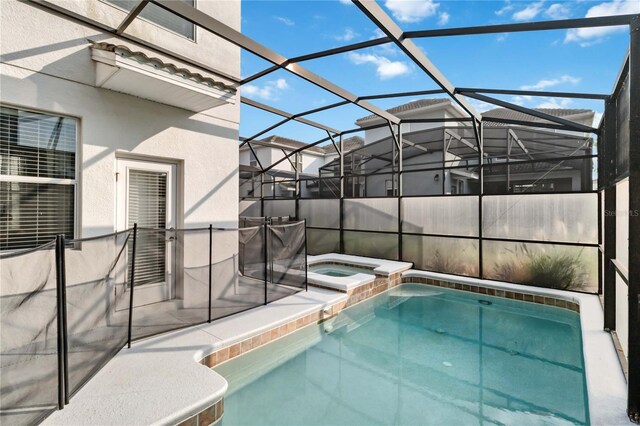 4740 Sleepy Hollow Dr, Kissimmee, FL 34746 - view of swimming pool featuring a pool with connected hot tub and glass enclosure