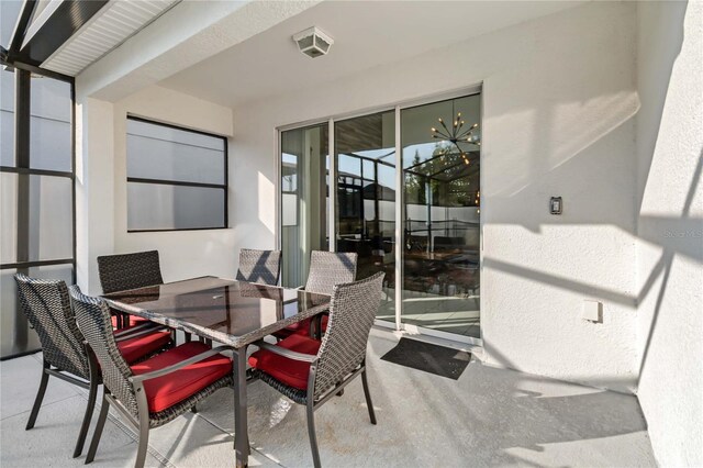4740 Sleepy Hollow Dr, Kissimmee, FL 34746 - sunroom featuring a chandelier