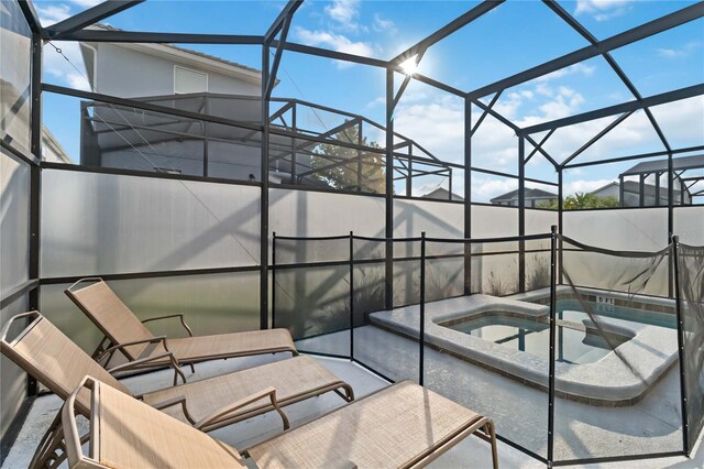 4740 Sleepy Hollow Dr, Kissimmee, FL 34746 - view of patio / terrace featuring glass enclosure and a pool with connected hot tub
