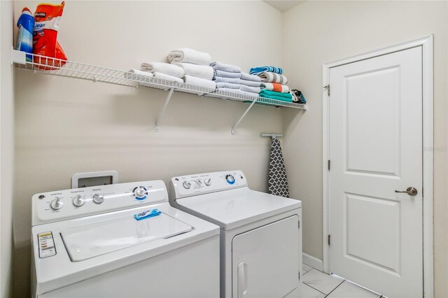 4740 Sleepy Hollow Dr, Kissimmee, FL 34746 - laundry room featuring separate washer and dryer and baseboards