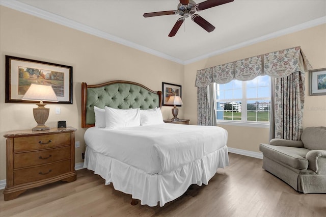 1100 Sunset View Cir Unit 204, Reunion, FL 34747 - bedroom with light wood finished floors, ornamental molding, baseboards, and a ceiling fan