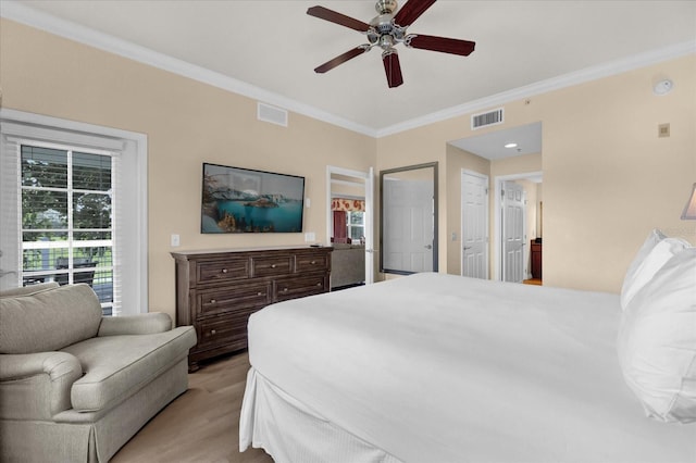 1100 Sunset View Cir Unit 204, Reunion, FL 34747 - bedroom with crown molding, light wood-type flooring, and ceiling fan