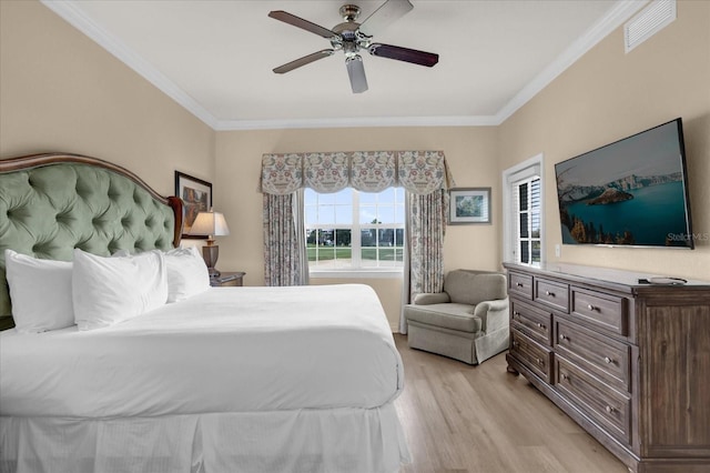 1100 Sunset View Cir Unit 204, Reunion, FL 34747 - bedroom featuring light wood-type flooring, ornamental molding, and ceiling fan