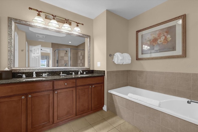 1100 Sunset View Cir Unit 204, Reunion, FL 34747 - full bathroom with a garden tub, double vanity, a stall shower, and tile patterned flooring
