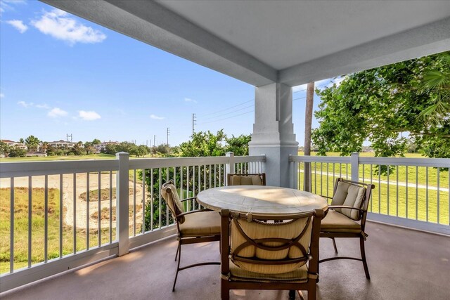 1100 Sunset View Cir Unit 204, Reunion, FL 34747 - balcony featuring outdoor dining area