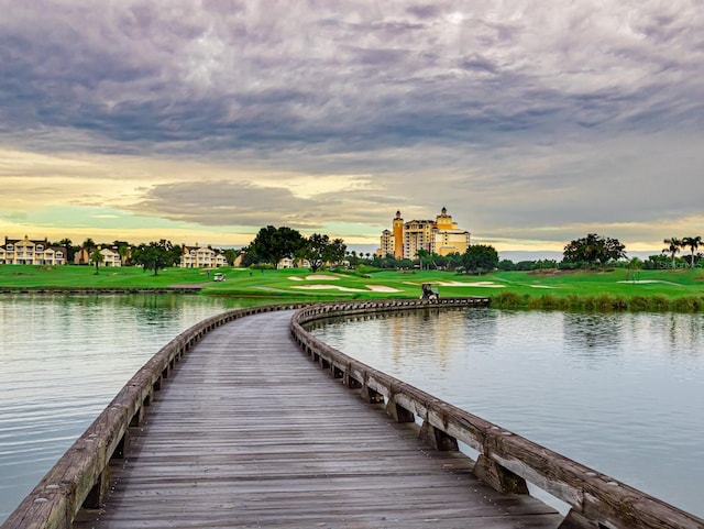 1100 Sunset View Cir Unit 204, Reunion, FL 34747 - dock featuring a water view, golf course view, and a yard