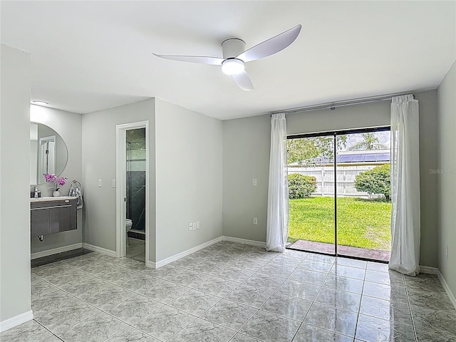 620 Wood Dr, Kissimmee, FL 34759 - spare room featuring a ceiling fan, baseboards, and arched walkways