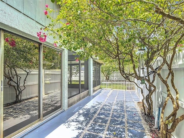 620 Wood Dr, Kissimmee, FL 34759 - deck with a sunroom, a fenced backyard, and a patio area