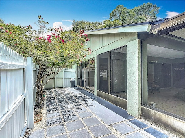 620 Wood Dr, Kissimmee, FL 34759 - view of patio / terrace featuring a sunroom