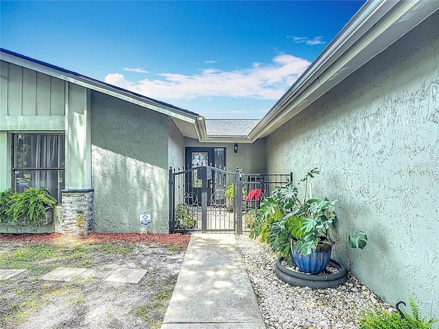 620 Wood Dr, Kissimmee, FL 34759 - entrance to property with a gate and stucco siding