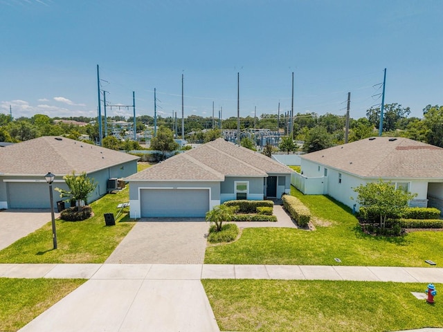 14357 Hidden Ct, Clermont, FL 34711 - ranch-style home with an attached garage, a front lawn, driveway, and a shingled roof