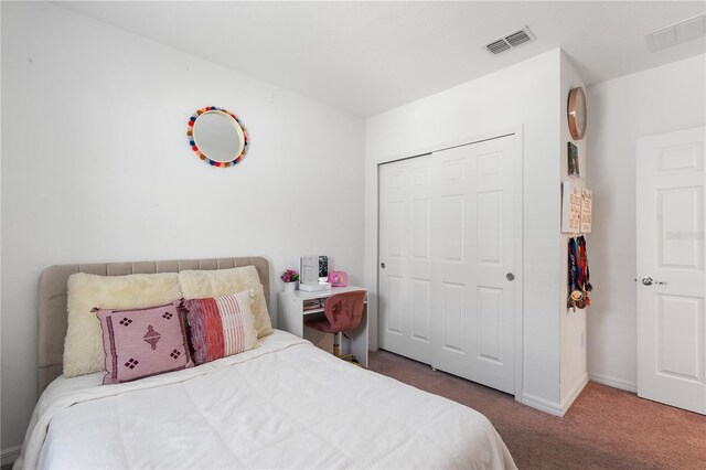 14357 Hidden Ct, Clermont, FL 34711 - bedroom with carpet, a closet, and baseboards