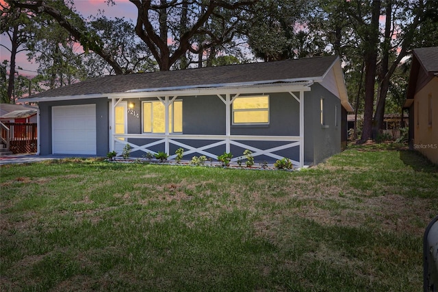 7214 Oakwood Dr, New Port Richey, FL 34652 - ranch-style house featuring stucco siding, a lawn, and roof with shingles