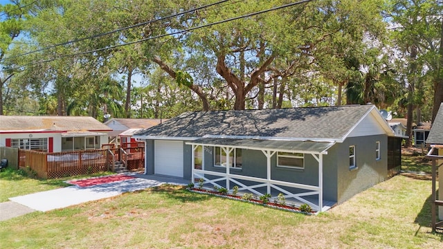 7214 Oakwood Dr, New Port Richey, FL 34652 - view of front of house with stucco siding, asphalt driveway, a front yard, and a deck