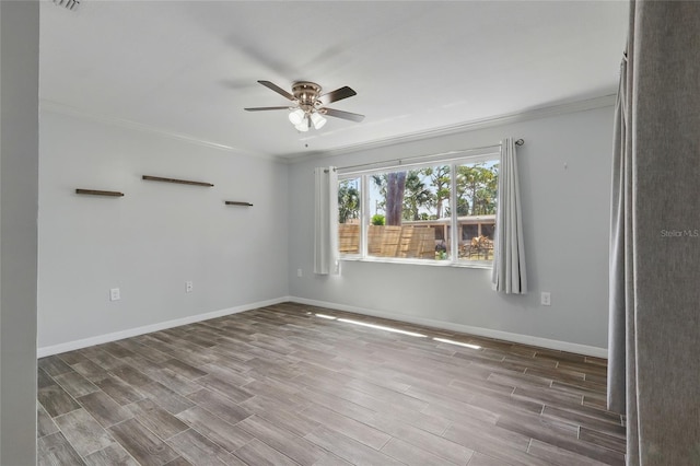 7214 Oakwood Dr, New Port Richey, FL 34652 - unfurnished room featuring a ceiling fan, wood finished floors, crown molding, and baseboards