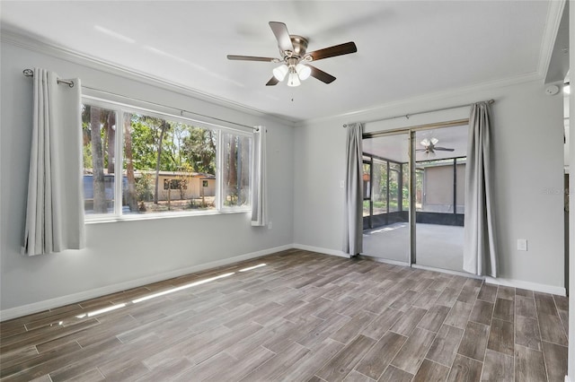 7214 Oakwood Dr, New Port Richey, FL 34652 - unfurnished room featuring ceiling fan, crown molding, wood finished floors, and baseboards