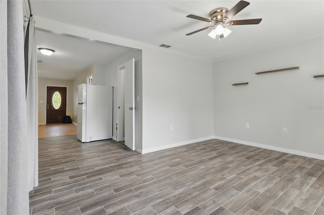 7214 Oakwood Dr, New Port Richey, FL 34652 - empty room with a ceiling fan, baseboards, light wood-style floors, and ornamental molding