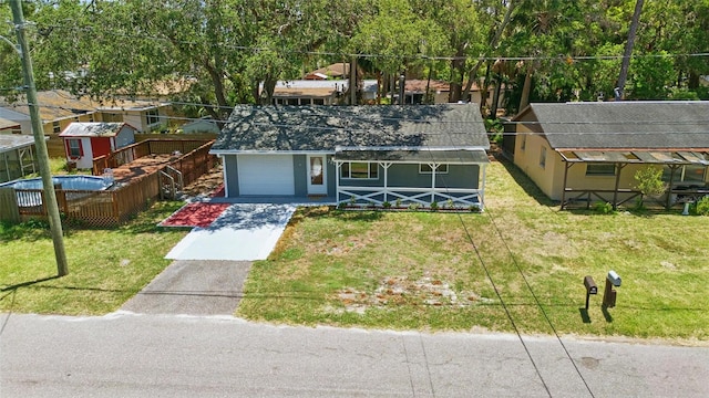 7214 Oakwood Dr, New Port Richey, FL 34652 - view of front of property with concrete driveway, a front lawn, and an attached garage