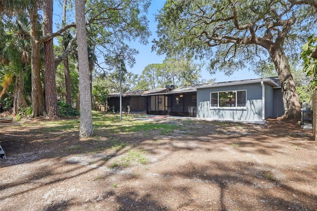 7214 Oakwood Dr, New Port Richey, FL 34652 - view of front of house with a sunroom and stucco siding