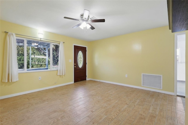 7214 Oakwood Dr, New Port Richey, FL 34652 - entrance foyer with ceiling fan, light wood-style flooring, and baseboards