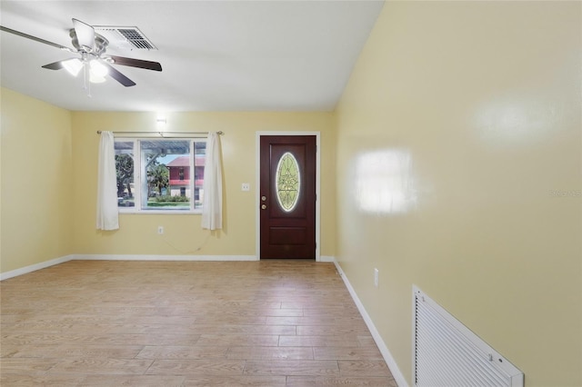 7214 Oakwood Dr, New Port Richey, FL 34652 - entryway featuring light wood-style flooring, a ceiling fan, and baseboards