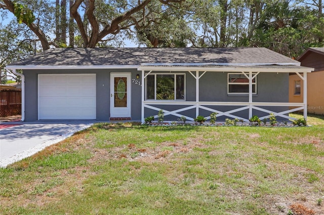 7214 Oakwood Dr, New Port Richey, FL 34652 - ranch-style house featuring a garage, stucco siding, a front yard, and driveway