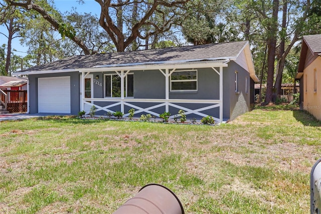 7214 Oakwood Dr, New Port Richey, FL 34652 - view of front facade featuring stucco siding, covered porch, a front lawn, and a garage