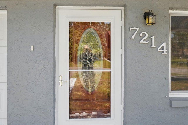 7214 Oakwood Dr, New Port Richey, FL 34652 - entrance to property with stucco siding